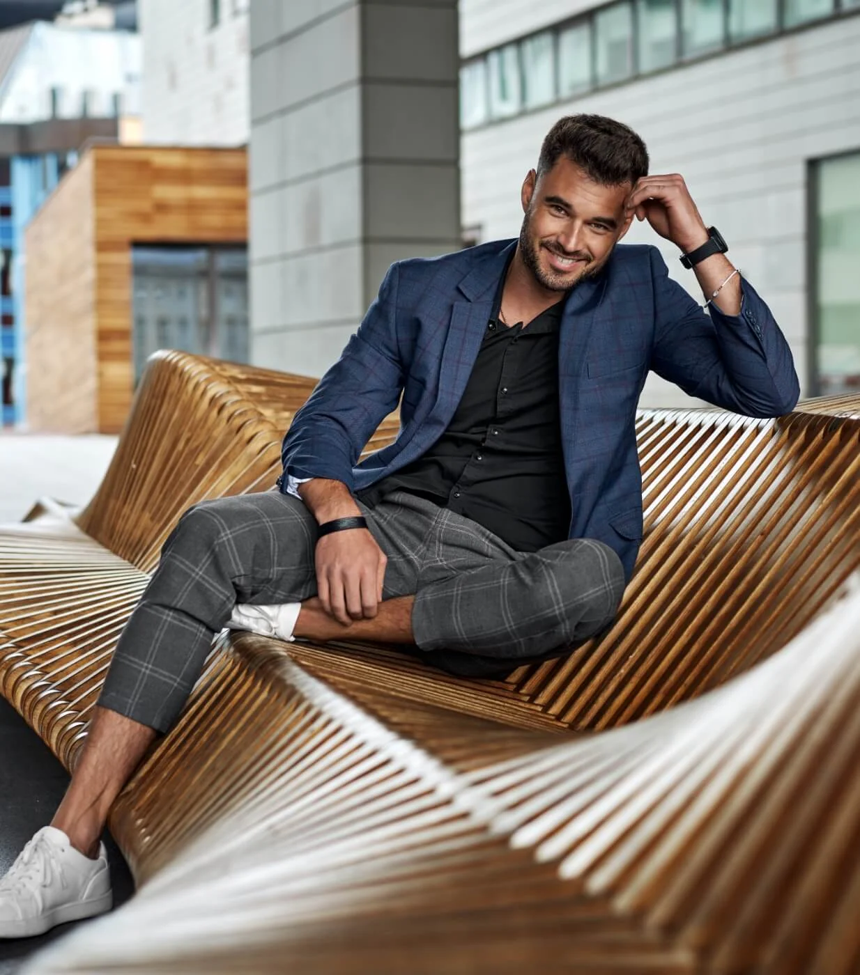 man sitting on a modern outdoor area
