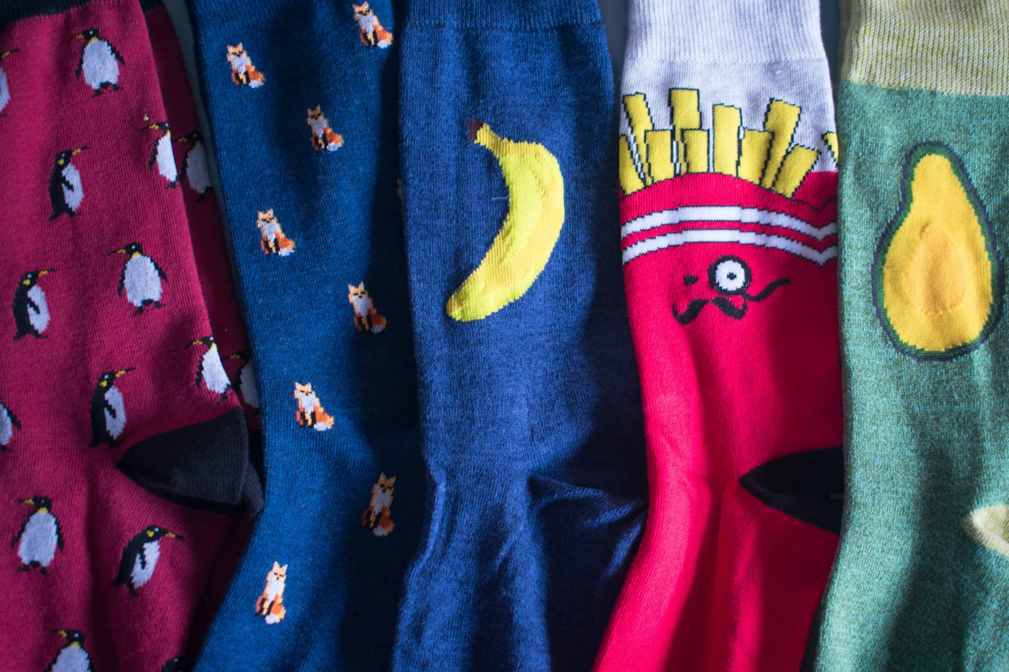 Colourful patterned socks laid side by side